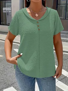 Detail view of avocado green textured V-neck t-shirt with decorative buttons.