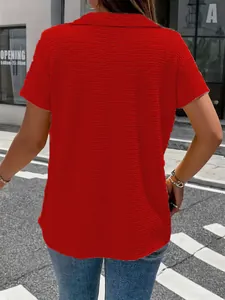 Detailed back view of a vibrant red textured short-sleeved t-shirt for women in street