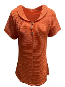 Women's orange textured short sleeve polo shirt featuring a stylish three-button collar