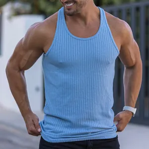 Close-up of men's blue ribbed racerback fitness tank top on a muscular model outdoors