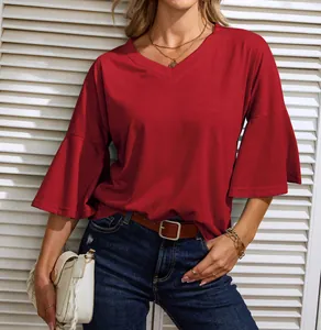 Close-up view of a women's red bell sleeve top with V-neckline and relaxed casual styling.
