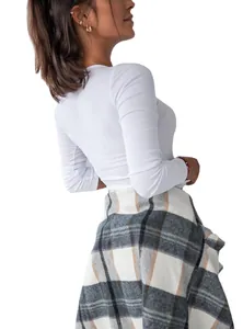Slim-fit white long-sleeve ribbed knit top for women with a minimalist design