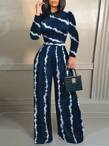 Full length detailed view of elegant tie-dye long sleeve wide-leg jumpsuit with stand collar