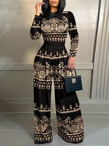 Detailed view of long sleeve jumpsuit with vintage ethnic pattern and wide leg