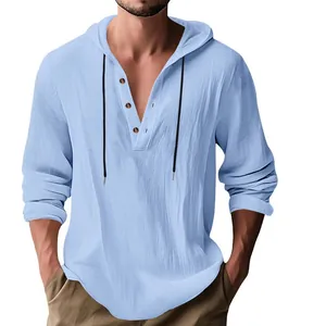 Close-up of men's hooded linen Henley shirt with wooden buttons and drawstring detail.
