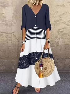 V-neck patchwork maxi dress with buttons featuring navy stripes and polka dots pattern.