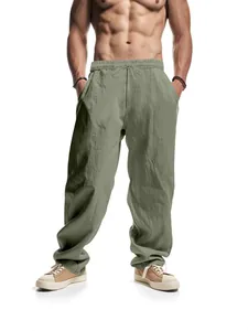 Close-up showing the sage green linen wide-leg pants texture and comfortable drawstring waist