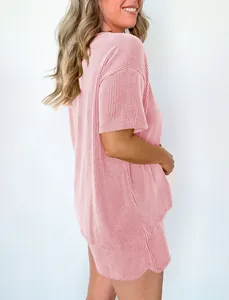Side view of pink wavy ribbed two-piece set with short sleeve top and matching shorts
