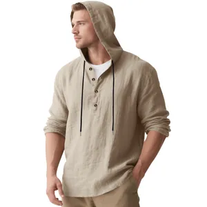 Detailed view of men's loose linen hooded long sleeve Henley shirt in khaki beach style