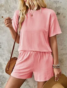 Detailed view of a pink wavy textured two-piece summer set with short sleeve top