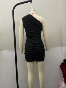 Detailed back view of a sexy black one-shoulder ruched bodycon mini dress on mannequin