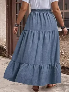 Stylish summer plus size tiered maxi skirt in blue denim texture for vacation wear