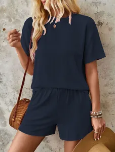Detailed macro view of navy blue summer two-piece set featuring wavy texture fabric