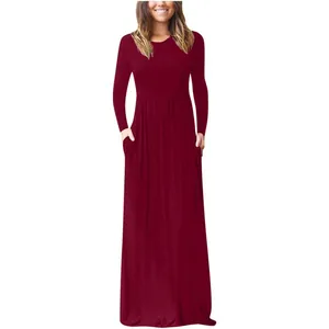Close-up of the elegant burgundy round neck long sleeve maxi dress with pockets