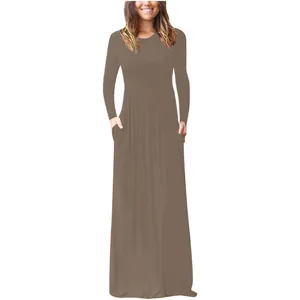 Elegant solid brown long sleeve maxi dress featuring functional pockets and round neck