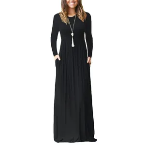 Detail view of long-sleeved black maxi dress with crew neck and functional side pockets