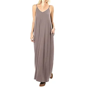 Full-length view of a solid color loose sleeveless maxi dress with functional pockets.