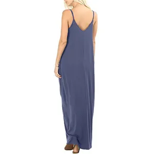 Back view of a long solid dusty blue spaghetti strap maxi dress with a loose fit