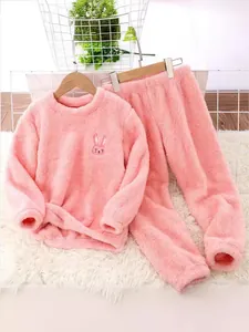 Cozy pink flannel kids pajama set featuring a cute cartoon bunny embroidery for girls and boys