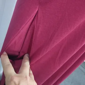Close-up of functional side pocket on a soft burgundy sleeveless maxi dress.