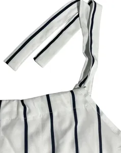 Close-up of white and navy striped tie shoulder straps and neckline detail stitching