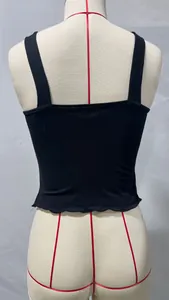 Detailed back view of a black sleeveless crop top with lettuce edge hem on a mannequin