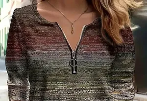 Close-up of V-neck zipper and gradient print on a women's slim-fit casual top