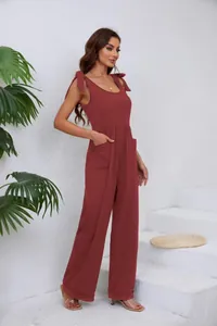 Combinaison élégante rouille à jambes larges avec nœuds aux épaules et poches latérales