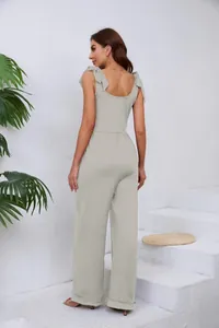 Vue arrière d'une combinaison grise à jambes larges avec nœuds et décolleté en U