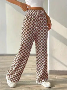Detailed view of women's checkerboard straight-leg pants with high waist and drawstring.