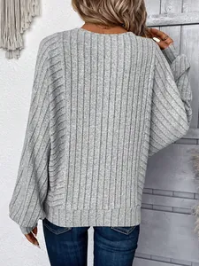 Back view of a casual grey ribbed knit pullover sweater with long sleeves and round neck