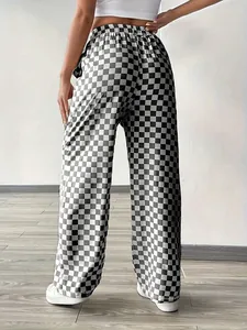 Back view of high-waist straight-leg trousers with classic black and white checkerboard pattern