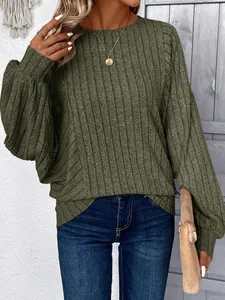 Close-up of olive green ribbed knit pullover with round neck and lantern sleeves.
