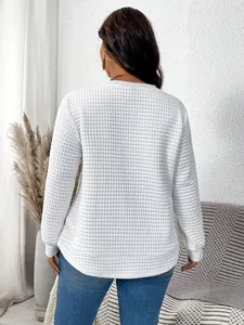 Back view of white plus-size quilted texture sweatshirt with curved hem for women