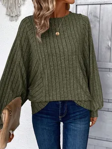 Close-up of olive green ribbed knit crewneck long sleeve top with soft texture