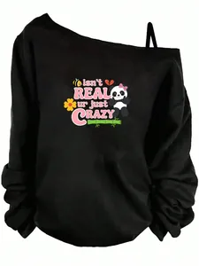 Detail view of black off-shoulder long sleeve top with isn't REAL ur just CRAZY panda graphic