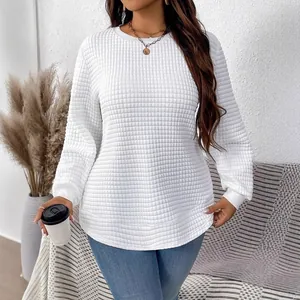 Detail view of the textured waffle knit fabric on this white plus size sweatshirt.
