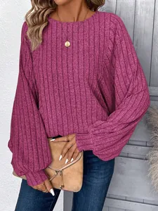 Detail of magenta ribbed knit sweater featuring elegant lantern sleeves for women