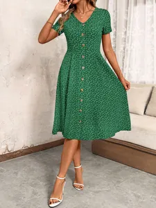 Green V-neck short sleeve midi dress with heart print and decorative button-down front
