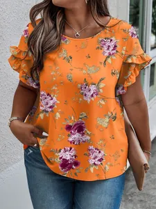 Detail view of orange floral plus size top with ruffled sleeves and relaxed fit.