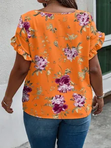 Rear view of a stylish women's floral print orange blouse with feminine ruffle sleeves