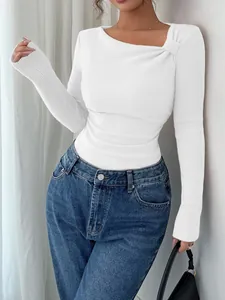 Elegant white ribbed long sleeve top with an asymmetrical knotted neckline and slim fit design