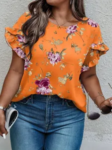 Detail view of a vibrant orange floral print plus size top with stylish ruffle sleeves.