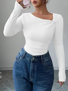 Detailed close-up showing the elegant asymmetrical pleated neckline on a white ribbed top