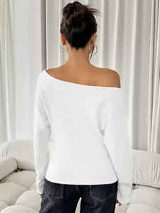 Close-up back view of a stylish white off-shoulder long-sleeved knitted top for women