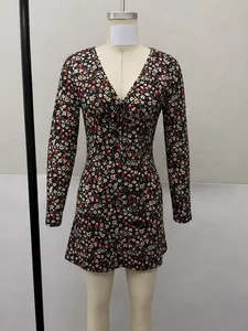 Detailed view of a slim fit long sleeve floral print mini dress with a plunging V-neckline