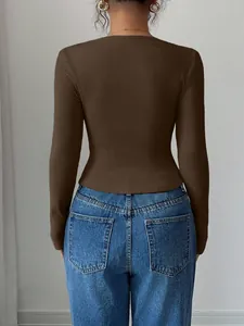 Back view of a women's brown slim-fit ribbed long-sleeve knit top with texture detail