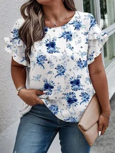 Close-up of elegant blue floral print and ruffled sleeves on white summer blouse