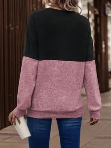 Back view of a chic color-block long-sleeve casual sweatshirt in black and dusty pink