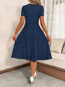 Detailed back view of a navy blue dress showing the heart polka dot pattern and A-line cut